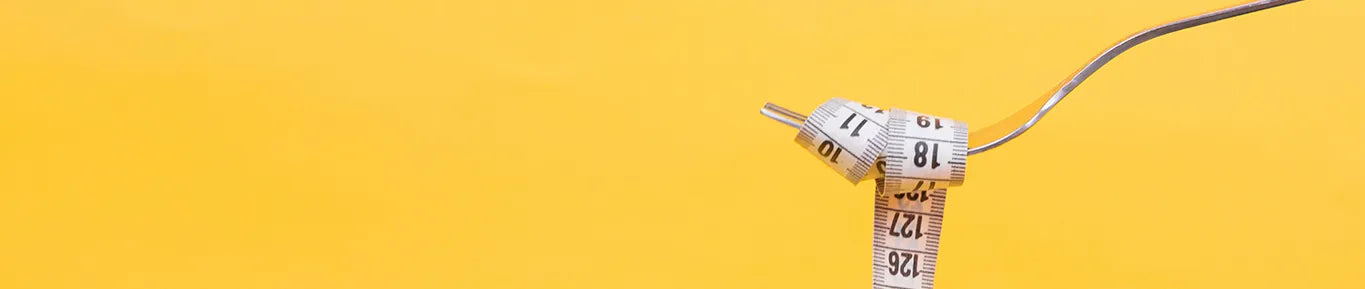 fork holding measuring tape